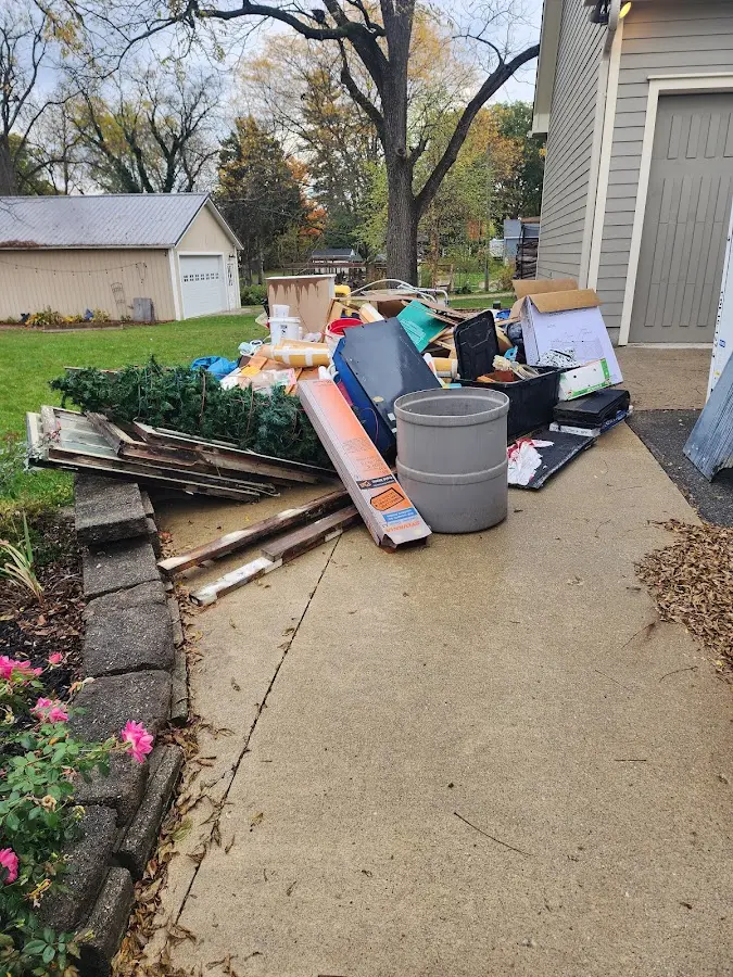 Dumpster being loaded with debris for 3 Yard Dumpster Rental in West Carrollton